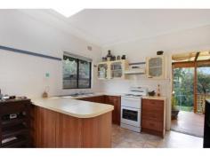 38 Buttenshaw Pl Austinmer NSW 2515 Situated in a peaceful
cul-de-sac nestled against the escarpment this home is the retreat you
have been searching for. Encompassing all of the benefits of escarpment
living, where friendly wildlife regularly visits, the setting could not
be more serene. This uniquely charming cottage is ready to move in, yet
has potential to modernize and put your own mark on. With high ceilings,
lovely cornices and polished floorboards, the potential is enormous.
Features:- - Two of the bedrooms have full size mirrored built-in
wardrobes - The home enjoys the comforting warmth of a combustion wood
heater in the lounge room, perfect for the cooler months - The is a
separate room off the lounge room, perfect for formal dining or a home
office - Relax with a cuppa on the gorgeous sun filled undercover
entertainment deck, overlooking the north facing native gardens - The
laundry is off the rear deck with additional toilet, very useful when
entertaining - Across the road is the beautiful escarpment rainforest
with established Lady Fuller walking trails for the nature lovers, and
school bus stops near by - Just a short trip to Austinmer beach and
train station, this location is bound to appeal to those who want the
best of both worlds. A must see. Inspections by appointement only. Please book your viewing on: Saturday 16 August 12:00 - 1:00 or Wednesday 20 August 3:00 - 4:00 Property Features: Building 3 Bedroom 1 Bathroom 2 Parking 784m2 Land Size