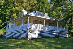 1 Upper Coopers Creek Rd Upper Coopers Creek NSW 2482 Adjoining National Park & Wanganui Gorge is this 33 acre property fronting a long wide creek with multiple water holes - less than 5 minutes walk from 2 of the dwellings. With a charming 2 bedroom Queenslander with glorious northerly views, a shabby artists shack overhanging the most magical rainforest & alongside where the waterfalls spill into the beginning of the beautiful Upper Coopers Creek. At the highest point of the property where the views are nothing short of magnificent, the third cabin is positioned adjacent to nature and glorious open lawns. With an orchard boasting a variety of fruit trees including lychees, mangoes and guava and pockets of cleared land, unspoilt rainforest and old growth forest, this amazing property must be seen to be believed!