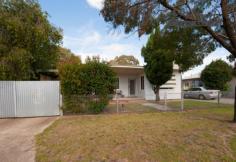 470 Griffith Rd Lavington NSW 2641 Neat and tidy 2 bedroom plus study home offering 2 good sized living areas, one of which could be turned into a 3rd bedroom if required. Massive kitchen with gas cooking, dishwasher and air conditioning, gas heating & evaporative cooling. Polished floorboards to front lounge room and hall, carpet to sunroom and bedrooms. Plenty of secure parking includes; single carport behind gates, another double carport behind gates and a massive 4 car lockable garage! All this situated on a great sized block with secure yard for kids / pets to run! Zoned B4 this property has potential as a commercial premises. Presently renting at $200 per week the block is 981m2. Property Features Property ID 10102863 Bedrooms 3 Bathrooms 1 Garage 4 Single carport, double carport & 4 car lock-up garage Carports 3 Single carport, double carport & 4 car lock-up garage Inclusions Fixed floor coverings, curtains, blinds, light fittings, T.V antenna Land Size 981 Square Mtr approx. Rental Return $200 Weekly Actual Rates $1447.05 Yearly
