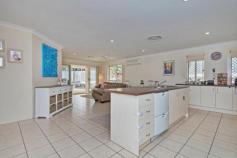 9 Worth Ct Upper Coomera QLD 4209 Welcome to the most jam packed, feature filled, suburban family home
available on the market. In need of something that fits your family,
friends, pets and the hobbies... this is the home that fits the bill,
and it's well worth it! Quality, space, location, price and charming
family appeal are just a few of the superior features this home is
packed with. * Four large sized family bedrooms. The spacious
master has a large walk-in wardrobe, a large private ensuite and windows
that overlook your private pool area and surrounding bushland. * Impressively well kept and not a thing to do but move in and enjoy easy living. *
Two large internal living areas comprising of a completely separate
formal lounge or children's rumpus room at one end of the residence and
an open plan dining/kitchen combination that overlooks your sheltered
rear yards. This floor plan has been perfectly planned to provide for
the various needs of an expanding family. * You will find a huge
central kitchen that will excite every buyer, equipped with modern
appliances, great storage space, large counter tops and stylish decor. *
The bedrooms have also been well arranged, with a separate 4th bedroom
or home office at the front of the home, this room has sliding doors out
to the side yard space and is perfect for overseas guests, homework
area or study. The remaining 2 double sized children's bedrooms are both
spacious and flooded with natural light. The large master bedroom is
positioned to the rear of the property and has been fitted with a
stylish private ensuite and walk-in robe. * Complimenting the whole
home is a beautiful tranquil private in-ground swimming pool area with
solar heating, private outlook and adjoining massive undercover alfresco
area for summer barbeques. * Secluded 1000sqm flat battleaxe block
that offers wonderful side access, room for a shed, off street parking
(in addition to the double lockup garage) ideal for boats, caravan or
any hobby that requires space. * Flawless low maintenance landscaping, flat yard space for the children or pets and no neighbours means absolute privacy! *
Additional features include: ducted air conditioning, impeccable
condition, ceiling fans throughout, security screens, rain water tank
and garden shed just to name a few. *Located in a modern and quiet
pocket of Upper Coomera, this impeccable home is a wonderful place to
raise your family. Public transport comes right to estate entrance with
approximately nine local schools within a 10 minute drive, shops, parks,
waterways, medical centres, train, M1 motorway, equestrian centres,
restaurants, child care, public swimming pools, you name it. To top it
all off, this home is situated in a quiet and family friendly
cul-de-sac. All in all the most impressive element this home is
its overall lifestyle appeal and set up to accommodate any buyer's
needs... a home like this, packed with so many assets will likely draw
the eye of many buyers, so pick up the phone and arrange an inspection
soon!