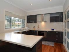 23 Austral St Nulkaba NSW 2325 If elegance is what your looking for. Look no further. This stunning 3 year old McDonald Jones Home has had no expense spared. This home is just waiting for you and your family. With features such as ducted air conditioning, ducted vacuum system, remarkable bamboo flooring, high ceilings with LED down lights, games/activities room, walk-in linen, ceiling fans to all bedrooms and a magnificent Egyptian Crystal chandelier in the entry foyer with coffered ceilings. The master bedroom has a large open ensuite and walk-in wardrobe. Walking out side through the sliding stacking glass doors onto a covered alfresco area you will find a Compass self cleaning salt-water pool run by a 2.5Kw Solar system, landscaped retaining walls plenty of room for the little ones to run around on and a double garage with workshop bigger than most homes! At approx 120m2 this garage with power and lighting will make a perfect man cave. Make your move NOW!