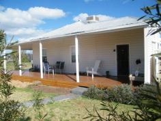 1 Conlon St Quirindi NSW 2343 3 bedroom weatherboard home, freshly painted and fully renovated. Situated on a large 954.8sqm block in a quiet location. All bedrooms have ceiling fans and ducted evaporative air conditioning throughout. Wide timber verandahs on Northern and Western side. Open plan kitchen/dining area ,living area and bedrooms carpeted. Ducted evaporative air conditioning and slow combustion wood heater in living area. New double lockable garage with cement floor as well as carport. This is a large block of land , fully renovated home ,set in a quiet street. Great value , would suit first home buyer or investor, well worth inspection.