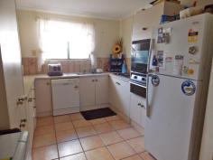 7/4 Aneura Pl Sadadeen NT 0870 Situated in the Sadadeen area close to schools, shops and transport is this end three level townhouse. The unit is almost at the top of the block with fabulous views of the surrounding areas and MacDonnel Ranges. Entry is to the front verandah which can double as a 2nd outdoor living area. The lounge area is tiled, boasts a reverse cycle air conditioner and has a handy storage area under the stairwell. The spacious second level area is tiled with the kitchen having electric cooking, dishwasher and ample cupboard and bench top space. The internal laundry is on this level as well and also a second toilet. Up the stairs to the top level you will find two bedrooms both with carpet and built in wardrobes. The main bathroom has shower over bath, vanity and toilet inclusive. Your private courtyard is paved and has a lovely shaded timber pergola and there is a side gate that allows you access to your unit from the side.