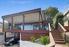 95 Rose Avenue, WHEELER HEIGHTS NSW 2097 Architect designed modern & stylish family home in a quiet &
private setting. Living spaces flow out onto an expansive wrap around
hardwood balcony providing seamless indoor/outdoor living. These
outdoor rooms have sloped ceilings to ensure nothing disturbs your view.
Inside consists of open plan kitchen, lounge & dining area with
separate media/movie and rumpus rooms. There are 3 spacious bedrooms
and 2 stunning bathrooms. The substantial outdoor living spaces provide
enough room for alfresco dining, outdoor lounging (including a wall
mounted TV), a built in spa, level garden for the kids, car parking for 3
vehicles & huge amounts of storage. This home is constructed with
the highest of quality, has nothing for you to do but enjoy the beach
lifestyle. It has beautiful leafy views from almost every room, and is
easy walking distance to shops, schools, transport, parks & golf
course. A must to inspect.