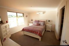 71 Sutcliffe Rd Waggrakine WA 6530 Built in 2011 by local custom build specialists Coral Coast Homes, this is an excellent family sized home, designed specifically to take the best advantage of the unusual 783sqm block and ocean views. There are four bedrooms, with the master having split system air conditioning, big walk in robe with plenty of shelving and hanging space to suit both him and her. The ensuite is eye catching with a stone tiled wall to the shower being the centre piece and extra long vanity bench area. To accommodate that growing family there are three additional bedrooms, two with ceiling height wardrobes with mirrored doors. There is yet another room that could be an ideal home office, a study or a nursery located at the front wing of the home. All living area flow together with distinctive tiled floors. The main living and dining area has a really spacious feel as it looks over the patio and ocean views. An additional games/living area can be divided off by the cavity sliding glass doors and all these living areas have split cycle air conditioners and down lights. Sure to please any family chef, the kitchen is designed for comfort with soft closing drawers and large pot drawers, stainless steel appliances including a dishwasher. a rounded glass range hood, a corner pantry, built in concealed spaces for the microwave and the bin.