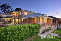 22 Planthurst Road Carlton NSW 2218 Charming family residence with modern finishes Character filled, open spaces and designer finishes, this family home blends together the old and new and has been architecturally designed for those that like to entertain. The home boasts 5 spacious bedrooms, 2 complete with en suites. All rooms have built in wardrobes and main with walk in robe. There is a separate study room which includes a custom built floor to ceiling library with wrap around desk, giving you maximum storage & space. The formal living area comes complete with a sleek wet bar and original fire place. The oversized informal lounge / dining area opens out onto the large undercover entertaining area that then flows onto the lush manicured gardens. The yard is level, secure, private and child friendly. The oversized designer kitchen includes Miele appliances,2 ovens, built in coffee machine, stone bench tops, gas cooking, dishwasher and soft close drawers. Other highlights of the property include high detailed ceilings, timber floorboards, ducted air conditioning, alarm system and private balconies with outlooks of the city. There's also a double lock up garage with remote access. This property is sure to impress and is a rare offering. 5 bedrooms plus study 2 master bedrooms both with en suites Formal and informal living areas Designer finishes throughout / Air con Double lock up garage with remote access Close to local shops, schools, parks and transport Other Features Air ConditioningBuilt-insClose to TransportDishwasherEntertainment AreaFireplace(s)Internal LaundryLock up GaragePolished Timber FloorsRemote Garage