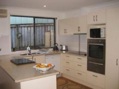 7 Hacking Court Coffs Harbour NSW 2450 Everyone will be happy in this family home, every box ticked! Do you want to run a swim school or work from home? There are plenty of bedrooms, if you have lots of children, or a perfect work from home office configuration if needed. Five bedrooms or three with office. This home is situated in a quiet cul-de-sac, private from the street with separate double garage and ample off street parking for boat, caravan or trailer. The kitchen and bathroom have been refurbished, nothing to do here and the separate lounge and rumpus areas offer the space a big family may need. The heated salt water POOL is INDOORS, certainly a rare opportunity to exercise or play year round - no excuses! No neighbours behind you but a beautiful open space reserve; you can be assured of a quiet, private place to call home. Take the time to call us today, we welcome your inspection... Whilst all care has been taken to ensure accuracy in the preparation of the particulars herein, no warranty can be given. Interested parties must therefore rely on their own investigations. In-ground poolFencedSpaIndoor entertainment areaCourtyardWheelchair accessUndercover outdoor areaSmoke AlarmsOvenHot plateRange hoodDishwasherCeiling fansAir conditioning Bedrooms 4 Bathrooms 1 Garages 2 Land Area 670 m2