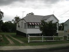 94 Downs Street North Ipswich QLD 4305 MASSIVE 1012SQM -- CLOSE TO CBD This solid neat and tidy Queenslander is not only just a stone's throw to the Ipswich CBD, it is positioned on a rare quarter acre size block! So whether its lifestyle you are chasing or simply your next project (STCA) -- this cracker of a property has potential plus stamped all over it. Flood free situated back from the street with side access to the expansive rear yard, it is also close to all amenities, quality local schools, transport options and the Riverlink Shopping Centre. It offers such character and charm throughout with stunning polished timber floors, gorgeous lead light windows and those cross breezes traditional of an era bygone. There is also a large sleep out at the front of the home, renovated bathroom plus a large recently renovated eat in kitchen with ample cupboard space. The 2 bay carport has a 5000L water tank and there is loads of storage space underneath where you will also find the laundry area. This property is now vacant -- don't delay your inspections on this! General Features Property Type: House Bedrooms: 2 Bathrooms: 1 Land Size: 1012 m² (approx) Outdoor Features Carport Spaces: 2 Other Features Polished Floors