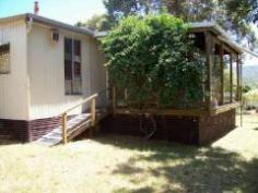 6669 South Coast Highway Nornalup WA 6333 Frankland River Retreat River views from all bedrooms are a feature of this older style roomy holiday home. There’s three bedrooms, one bathroom, an open lounge/kitchen and sun room with separate laundry and w.c. The home is timber framed with shadow line cladding, has a 10,000 gallon rainwater tank and new electric hot water system. An additional studio/carport is ideal for the extra visitors. The huge block may be capable of future subdivision. General Features Property Type: House Bedrooms: 3 Bathrooms: 1 Land Size: 0.41ha (1.01 acres) (approx) Price per acre: $495,050 Indoor Features Toilets: 1 Workshop Outdoor Features Carport Spaces: 2 Eco Friendly Features Water Tank $500,000