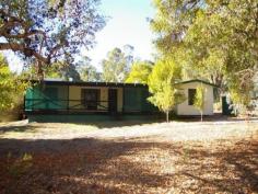 15 Number Nine Road Jarrahwood WA 6275 HOME ON APPROX. 117 PRIVATE ACRES WITH CREEK A rare mostly pastured property surrounded by state forest on all sides. Mill Brook runs right through the property and there is useful frontage to the Vasse Hwy for direct farm sales if required. An older style 4 x 2 home is positioned halfway through the property surrounded by timber lined workshop, sheds and carport. The house is surrounded by mature trees and gardens. The acreage is fenced into several paddocks with a holding yard and timber stock yards. Water is readily available through the brook, dams, windmill bore and a series of rainwater tanks. A small back road bisects the property into two halves this road provides one point of access to the very small community of Jarrahwood which lies just beyond the property. Inspection by appointment only. General Features Property Type: Lifestyle Bedrooms: 4 Bathrooms: 2 Land Size: 47.53ha (117.45 acres) (approx) Outdoor Features Carport Spaces: 4 Offers over $600,000