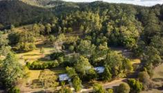 12 Mill Rd Pullenvale QLD 4069 Seeking star quality? You found it. On 10,000m2 with a majestic outlook, this property has cinematic views matched with character, style and elegance. From the separate home office to the spacious bedrooms and exceptional kitchen, there truly is no place like home. Here’s why. The Interior Features * 5 king-sized, bright and beautiful bedrooms, all with built-ins * 3 bathrooms, with 2 beds sharing a bath and master with ensuite * Reverse cycle air conditioning and ceiling fans throughout home * Sparkling timber floors and tiles throughout * Open plan living and entertaining * Gorgeous chef’s kitchen features granite benches with Bosch appliances and extensive walk-in pantry * Kitchen and dining connect to expansive decks to easy entertaining * round-level rumpus area or teen hang-out for the kids Granny Flat or Separate Home Office * Separate granny flat or exceptional home office space * Separate entry and garage * Equipped with shower and basin * Ready for kitchenette and loo installation The Property * Area 10,000m2 or approx. 2.5 acres with 62.6m2 street frontage * Elegant French doors open to expansive outdoor entertaining area and timber * decks with heavenly outlook * Tropically landscaped saltwater pool shielded by palms for private dip * Established, water-wise gardens meet rambling views * Town and tank water access * Horse stable on the grounds, ready with a little TLC The Surrounds * Kenmore and Pullenvale schools nearby * 100m to bus stop for transport to schools, university and CBD * 5 mins to Kenmore Shopping precinct and restaurants * Short stroll to the Rafting Ground Reserve and parklands * 100m walk or ride to Moggill Conservation Park, where dogs and horses are welcome! Inspired Realty knows that properties with this much panache sell in a flash. Pullenvale homes with this much on offer and so close to parks are prime locations, irrespective of market fluctuations. If you’re in the market for something really special, you’ve just clicked on it. Inspect this magnificent property over the coming weeks and make sure you make it yours! 12 Mill Road, Pullenvale