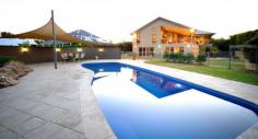 32 Glenabbey Dr Dubbo NSW 2830 Auction 06/11/2014 at 6:00 PM Property: House Bldg: Cement Rendered Land: 2525 Sqm Council: Dubbo Pool: Yes Age: 9 Rooms: Lounge/Living Office Rumpus Room Family Room Dining Room Other Areas: Laundry Area- Internal Formal Entry Walk-in-Pantry Courtyard Complex: Barbecue Area Furnished: N Majestic Family Home with Scenic Views Positioned in prestigious Kintyre Estate offering beautiful panoramic views over Dubbo and the Harvey Ranges, this luxurious property with grand proportions is nestled on a peaceful 2,525 sq m block (approx). The sheer vastness of the family home is immediately impressive with a collection of three living areas, four generous sized bedrooms plus office or fifth bedroom and large elevated entertaining patio overlooking the solar heated inground pool. If you are looking for a lifestyle that affords living without compromise, you must simply inspect this property. Features: - Four oversized bedrooms - Stunning master retreat includes dressing room/walk-in robe and beautiful ensuite - Office or fifth bedroom - Lavishly appointed bathroom - Centrepiece formal lounge room with magical views - High gloss kitchen overlooking the family and dining areas with vaulted ceiling and views - Huge downstairs games room with impressive bar/kitchenette and third bathroom - Laundry offering loads of storage - Zoned, ducted reverse cycle air conditioning - Natural gas points - North East facing, elevated entertainers patio with superb views - Inground, solar heated pool with entertaining terrace - Landscaped yard providing privacy and including rear utilities storage and fire pit area - Three car garage with auto doors (one bay currently fitted with storage shelving) - Built by Rod Dunkley and hand picked tradesmen - Town water, tank water, town sewer, underground 3-phase power available - Peaceful retreat on a 2,525 sq m (approx) parcel - Elevated views over Dubbo, Harvey Ranges and zoo - Short drive to Dubbo Golf Course, cycleway, private and public schools, Delroy Park Shopping Centre, Woolworths Supermarket and CBD amenities The information and figures contained in this material is supplied by the vendor and is unverified.Potential buyers should take all steps necessary to satisfy themselves regarding the information contained herein.
