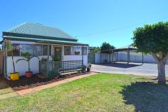 30 Buller Street Kalgoorlie WA 6430 MORE THAN MEETS THE EYE This pretty 3 x 1 central Kalgoorlie home has way more than meets the eye. Situated on a quarter acre block (1012m2) with 20m frontage and rear lane access within the South Kalgoorlie Primary School zone. The fibro home consists of 3 bedrooms with built in robes to the master bedroom. One bedroom has original pressed tin walls which are delightful. Also inside the home is a study, a sleep-out and a utility room, all of a suitable size. Combined modern, tiled kitchen/lounge area with gas cooktop, electric oven and excellent bench space. Gas heating plus the option of reverse cycle air-conditioner for year round comfort completes this comfortable living space. There is also a formal dining room with new carpet. The bathroom features a bath, shower and vanity with separate WC. As an added bonus there is a second WC outdoors. Horse stables are in place at the rear of the block plus many bird cages for the enthusiast. 2 workshops and an easy care garden complete with established fruit trees make this an attractive family home. Last, but by no means least, there is a horse stable registration in place for this property until 30/6/2015 General Features Property Type: House Bedrooms: 3 Bathrooms: 1 Land Size: 1012 m² (approx) Indoor Features Toilets: 2 Air Conditioning Outdoor Features Carport Spaces: 2 Other Features Built-In Wardrobes,Close to Schools,Close to Shops,Close to Transport,Garden,Registered Stables $299,000
