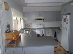 8 Railway Parade Injune QLD 4454 $270,000 Neg. Lowset 3 bedroom home in a thriving small town.Open Plan living area opening onto front verandah. Lounge has reverse cycle air-conditioning, fan & wood heater. Kitchen has electric stove, dishwasher & rangewood. Main bedroom is carpeted, built-ins and ceiling fan. Main bathroom has shower, toilet and another separate toilet. Laundry with linen cupboards. Access to 2 car garage from house! Side verandah with ramp. Huge outdoor area at rear of house with established gardens and palm trees. House is connected to 2 x 13600 Rain Water tanks as well as town water. 8x8 metre steel shed with cemented floors at rear of house with single three phase power. Tenure Type: Leasehold $800 yearly. Read more at http://roma.ljhooker.com.au/C8HG2#21cyxwuFbI1Flcbi.99