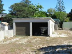 7 Manning St Manning Point NSW 2430 This is a rare opportunity to purchase a fully serviced building block centrally located at Manning Point.
The block is situated one street back from the main street and within
easy walking distance to the beach, river, Bowling Club and shop.
The block has an area of 445m2, is fully serviced and improvements include a double lock up garage
