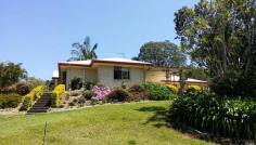 1 ( Lot 9 ) Annwal Lane Hunchy Qld 4555 $599,000 This superb acreage in Hunchy delivers a relaxing country lifestyle and is sized to reap the benefits of sustainable living just 5 minutes from Palmwoods and Montville. The property features a comfortable and well maintained three bedroom brick home overlooking the picturesque grounds with fruit trees and vegie patch. There is a large lock up shed, operational bore and 10,000 gallon rainwater tank at the base of the block. The house has rain water plumbed in and solar power. Only minutes to Palmwoods and Montville, this property must be seen. The owner says it is time to sell. Features include: 1.5 acres of useable land with full equipped operational bore 3 bedroom, master with ensuite and walk in robe Open plan kitchen, living and dining with split system air-conditioning Ceiling fans throughout Covered outdoor entertaining area with rollup blinds 2 door lock up remote control garage with in-house access 1.5kw solar power feed-in system 2 bay fully lockable steel shed with 3 phase power (includes welder, drill press, bench grinder, vice and benches)
