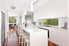 54A Burns Crescent Chiswick NSW 2046 sophisticated offering of unquestionable quality and refinement in a
blue ribbon harbourside setting, this breathtaking residence is quite
simply beyond compare. Flowing over three levels and finished to the
highest of standards, panoramic views stretch across the bay to the
distant skylines of North Sydney and the CBD. Occupying an elevated
setting that embraces privacy and tranquillity and flooded with natural
northern light throughout, this family home is designed for easy, low
maintenance entertaining. An ultra-contemporary masterpiece of rare
quality, it is minutes to parks and village life. Bright split level lounge and dining area, featuring in/outdoor ponds Marble tiled entertaining terrace, BBQ outlet and roof top garden Separate family room and theatre room / 4th bedroom with ensuite Generous master with walk-in robe, unique open ensuite with views Deluxe kitchen, CaesarStone island bench and glass splash-backs Sun-washed rear courtyard, sparkling lap pool with water feature Gas fireplace, heated tiled floor, polished timber and ducted air con