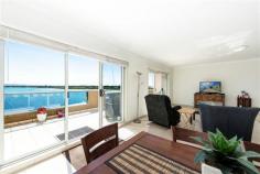 22/2 Belmont Street Swansea NSW 2281 It doesn't get much better than this! Watch the boats sail by. Spacious apartment located in Swansea's premier waterfront location Paris Apartments. Situated in this secured building overlooking Swansea Channel, you will enjoy sweeping views of Lake Macquarie. Upon entering the apartment you are met by a large dedicated foyer, which allows you to greet visitors whilst still maintaining privacy in the living areas. Moving through the foyer you walk through to the large air conditioned open plan lounge, dining and kitchen area. Also opening onto this area is a large room which could either be another living area, study or with the addition of a simple gyprock wall, a generous 3rd bedroom. The living areas flow out to a large, sunny tiled deck, the perfect place for entertaining and taking in the spectacular view. The generous kitchen is complimented by stainless steel Blanco appliances and granite benchtops. The 2 bedrooms in the apartment both feature large walk through robes, with the main enjoying an ensuite and the 2nd bedroom enjoying ensuite like access to the large main 3 way bathroom. With a dedicated parking bay plus single garage, car accommodation and storage is taken care of.