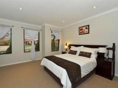 16 Strathalbyn Loop Carramar WA 6031 BURKE'S BACKYARD MEETS MASTERCHEF! Immaculately presented 4 bedroom 2 bathroom home with incredible chef's kitchen and impeccable manicured gardens. Warmth and ambience abound as you enter this home with blackbutt wood flooring and down lighting throughout. Absolutely huge bedrooms with large walk in robes (except bed 2 has BIR) and ducted air conditioning. This home is every Stepford Wife's dream with gorgeous kitchen featuring glass splash backs, large wide drawers, overhead cabinets, 900mm stainless gas cook top, stainless steel oven and dishwasher with an over sized bench top for easy entertaining. Stunning family and meals area overlooks the gorgeous outdoor area. Double width sliding doors featuring timber blinds open out to stunning alfresco with timber decking and Designer wind down Blind. Enjoy endless summer days and balmy nights sipping wine on the timber decked pool surrounded by lush Hibiscus and fragrant Roses. The well manicured garden features additional grassed area, shed and a fabulous fruiting olive tree. Domestic bliss with masses of storage and laundry fitted with storage cabinets, built in trough and walk in linen closet. Overview of features: General Features Property Type: House Bedrooms: 4 Bathrooms: 2 Indoor Features Toilets: 2 Air Conditioning Outdoor Features Garage Spaces: 2 Open Car Spaces: 4 Other Features Built-In Wardrobes,Close to Schools,Close to Shops,Close to Transport,Garden,Alfresco, gas point