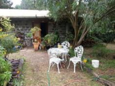 113 Acacia Road Grantville VIC 3984 Blue Stone Cottage with Sea Views Set on nearly 1.5 Acres this Blue Stone cottage is magical! From this hill top land you can easily see Western Port bay and beyond between the tall trees. This property also has a huge 3 bay garage and ample storage space. The garden has been extensively planted with native trees and shrubs yet there is still plenty of clear sunny spaces. There is lots of well surfaced driveway access all around the property and parking capacity for a dozen or more cars. Would suit someone with a boat, caravan, truck etc. The cottage is includes an open fire place and roof top lookout to take in the veiw. There is lots of level ground adjoining the cottage to allow for extensions into the future. A very unique and special property that you could easily fall in love with! General Features Property Type: House Bedrooms: 1 Bathrooms: 1 Land Size: 0.57ha (1.41 acres) (approx) Indoor Features Workshop Open Fireplace Outdoor Features Secure Parking Garage Spaces: 3 Deck Outdoor Entertaining Area Shed
