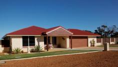 71 Sutcliffe Rd Waggrakine WA 6530 Built in 2011 by local custom build specialists Coral Coast Homes, this is an excellent family sized home, designed specifically to take the best advantage of the unusual 783sqm block and ocean views. There are four bedrooms, with the master having split system air conditioning, big walk in robe with plenty of shelving and hanging space to suit both him and her. The ensuite is eye catching with a stone tiled wall to the shower being the centre piece and extra long vanity bench area. To accommodate that growing family there are three additional bedrooms, two with ceiling height wardrobes with mirrored doors. There is yet another room that could be an ideal home office, a study or a nursery located at the front wing of the home. All living area flow together with distinctive tiled floors. The main living and dining area has a really spacious feel as it looks over the patio and ocean views. An additional games/living area can be divided off by the cavity sliding glass doors and all these living areas have split cycle air conditioners and down lights. Sure to please any family chef, the kitchen is designed for comfort with soft closing drawers and large pot drawers, stainless steel appliances including a dishwasher. a rounded glass range hood, a corner pantry, built in concealed spaces for the microwave and the bin.