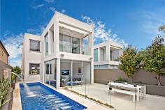 54A Burns Crescent Chiswick NSW 2046 sophisticated offering of unquestionable quality and refinement in a
blue ribbon harbourside setting, this breathtaking residence is quite
simply beyond compare. Flowing over three levels and finished to the
highest of standards, panoramic views stretch across the bay to the
distant skylines of North Sydney and the CBD. Occupying an elevated
setting that embraces privacy and tranquillity and flooded with natural
northern light throughout, this family home is designed for easy, low
maintenance entertaining. An ultra-contemporary masterpiece of rare
quality, it is minutes to parks and village life. Bright split level lounge and dining area, featuring in/outdoor ponds Marble tiled entertaining terrace, BBQ outlet and roof top garden Separate family room and theatre room / 4th bedroom with ensuite Generous master with walk-in robe, unique open ensuite with views Deluxe kitchen, CaesarStone island bench and glass splash-backs Sun-washed rear courtyard, sparkling lap pool with water feature Gas fireplace, heated tiled floor, polished timber and ducted air con