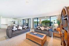 One of only a couple of
beachfront reserve apartment options available in Caves Beach, this
property distinguishes itself from the others in a big way. Offering
features far superior to its neighbours, in terms of bigger apartment
size, bigger garaging options and genuine ocean views with direct beach
access not available in the bigger apartment options set back from the
beach. Set in a more intimate group of only 5 apartments, this
property boasts the only internally accessed 2 car remote entry garage.
The current owners have their boat, car and plenty of shelving and
stored items comfortably arranged inside. The apartment itself
features generous, softly down-lit open plan living that flows off the
entry and out to an extremely large, covered outdoor living area. The
minute you walk inside you are taken aback by the unexpected
spaciousness of the living and also the delightful outlook to beachfront
shrubbery and ocean views. Spot the whales or count the ships and enjoy spectacular sunrises and amazing Nor Easterly breezes all summer long. The
living flows off the top end, quality, 2 pack and granite designer
kitchen, which is complete with not only an outlook to the living areas,
both inside and out but also the ocean view. The internal living
offers large dining and large lounge options with 2 sets of big stacker
doors connecting the living to the oversized, outdoor living and the
ocean view. A genuine, separate laundry also opens out to the deck and is complete with a very handy second toilet. The
deck boasts room for both outdoor lounge and dining options with a tap,
power and lighting all provided for extended easy all seasons
indoor/outdoor living. Back inside discover 2 king size bedrooms
both complete with generous built in wardrobes and easy access to the
oversized bathroom with a feature large heat pump spa and separate
shower.