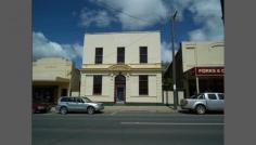 80 Main St Rutherglen VIC 3685 The Bank on Main - Rutherglen Victoria The Bank On Main is an
historic landmark building perfectly located on a large 1348 square
metre block in a central position in the main street of the very popular
village of Rutherglen. Currently operating as a B&B the two
story building has been extensively refurbished and features 2 guest
bedrooms both with spa ensuites and large guests lounge and dining room.
For the owners the Bank on Main also has 3 bedroom owners residence
with private lounge and kitchen. This B&B is easily operated
by one person and offers a great lifestyle and business combination in
Victoria's oldest wine region. The property was purchased by the
vendors in 2005 with the first guests in January 2006 and has shown
steady growth over the past 8 years. Rutherglen is ideally
situated only 2 hours North of Melbourne and is famous as a food and
wine destination. However Rutherglen is only 25 minutes from the twin
cities of Albury Wodonga, provides easy access to the Victorian Snow
Fields and the Mighty Murray River is close by. The owners also offers guests and tourists winery tours and would consider their unique 1925 Studebaker as an optional extra. Owners are seeking to retire and here is a beautiful home offering lifestyle and supplementary income.