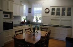 17 William St Millmerran QLD 4357 DETAILS $315,000 Residential Bedrooms: 4 Bathrooms: 2 Garage Spaces: 1 1st Time Opportunity—”The Post Office House” Available For Separate Sale – $315 000 Area: 1010 Square Metres – Renovated Queenslander with character and charm, 4 Bedroom timber home, all b/rs with ceiling fans & built-in storage, main b/r has ensuite & opens onto verandah, 2nd b/r has large w.i.r.. Large formal lounge room with fire place & ceiling fan, stylish main bathroom with shower over bath, toilet & vanity, wide hallway, wide polished original timber floorboards throughout, office, laundry with plenty of storage space, front verandah with northern aspect, single garage, under cover outdoor living area, cubby house, garden shed, established gardens, fenced yard. Only minutes to walk to the Main Street & all town amenities. Backyard access to Bowls Club