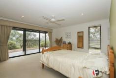 54 The Fairways Gnangara WA 6077 2.5 ACRES PLUS STUNNING HOME! BUSH LIVING IN THE METRO AREA! Bring the pony and the golf clubs! This beautiful property is low maintenance and set amongst gorgeous native bush, birds and trees, in the sought after "High side area of Gnangara" Stunning home with big glass doors, High atrium windows, wrap around timber decking, patios and entertaining areas with lovely elevated bush views. Especially designed for cooling & heating enjoying a big central feature fireplace, Feature fans to all rooms, and big central split air-conditioning. Huge open plan living with separate left wing for the Master bedroom and study and separate right wing for the minor bedrooms, bathroom & laundry. Privacy ensured! All rooms enjoy the stunning views! Huge king master bedroom with big glass doors to the decking enjoying awesome views. Spacious walk in robe and stunning big en-suite bathroom with deep luxury bath, big glass shower, feature vanity and quality fixtures Huge study/ or 5th bedroom. 2nd & 3rd Queen sized bedrooms both with double built in robes Double doors to 4th . General Features Property Type: House Bedrooms: 4 Bathrooms: 2 Building Size: 216.00 m² (23 squares) approx Land Size: 1.01ha (2.50 acres) (approx) Indoor Features Ensuite: 1 Open Fireplace Outdoor Features Garage Spaces: 4 Other Features RCDs, Deck, Verandah, Terrace/paved, Outdoor entertainment area, Undercover outdoor area $1,149,000