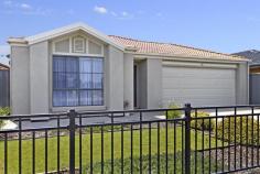 24 St Germain Ave Andrews Farm SA 5114 $295,000 - $320,000
This modern and popular designed home is located in a beautiful street
amongst other new homes and backs onto farmland rather than neighbours
behind. The beautiful coloured rendered front and b&d panel
lift door makes a great impression. The easy care small front yard with
artificial lawn and borders of plants and black tubular fencing finish
the home off beautifully. On entry the master bedroom is complete
with twin walk in robes and stunning ensuite which is finished in a
beautiful colour that enhances the sparkling white cupboards, tiles and
feature sink. Floating floors then lead you past the internal
access to the double garage and into the formal lounge. This room with
its east facing window would be a beautiful area to capture the morning
sun and then become a great home theatre room for watching movies at
night. Bedroom 4 is opposite making this a perfect guest room when needed. The
kitchen is impressive and has stainless steel Smeg Dishwasher, Blanco
appliances and large range hood, plenty of bench space that overlooks
the meals and family areas. The windows down the right create a
beautiful feel with glass sliding doors allowing plenty of natural light
to fill this area. This opens out to the low maintenance alfresco area
and rear yard complete with retaining wall, feature planting and high
good neighbour fencing. Bedrooms 2 and 3 both have built in robes
and are separated by the impressive bathroom with great size bath and
laundry with glass sliding doors that lead out to the clothesline. Other features include reverse cycle air-conditioning and instant gas hot water.