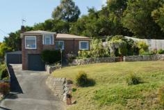 7 Gawler Rd Ulverstone TAS 7315 Sunny living areas with Bass Strait views This brick home sits proud upon its 814m2 (approx.) allotment. The north facing living areas are sunny and feature polished floorboards and views across town to Bass Strait. The kitchen has plenty of bench space and a walk-in pantry. The bathroom has recently been modernised and there are 3 bedrooms each with built-ins. There is a covered and private outdoor decking area for all your BBQ and entertaining needs. There are also 3 garages (each with remote controlled doors) with this property. A separate double garage at the end of the driveway and a large single garage under the house. Terraced decking, a chicken coop and low maintenance yard complete this property.