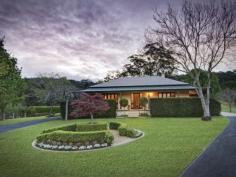 73 Phil Tunks Road, Dooralong The Epitome of Country Living
Gracefully poised on approximately 31 amazing undulating acres is
this stunning Dooralong Valley homestead. With a quintessential gated
tree-lined drive that is embraced by manicured mature gardens and a
generous outdoor decking from which to enjoy the stunning elevated rural
outlook; the country life does not get any better than this. Charming
warm interiors, French doors, stone kitchen and a dramatic sun-drenched
central living/dining space provide a versatile and functional floor
plan perfect for family living and entertaining. This incredible estate
also flaunts a full sized tennis court, sparkling 12 metre solar heated
in-ground pool, huge machinery shed plus stables and is all completely
fenced.