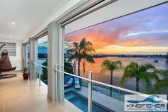 19 Kingfisher Crescent Burleigh Waters QLD 4220 Key Details property ID 274296 land size 965.00m2 build size 65.00sq Description MAGNIFICENT ARCHITECTUALLY DESIGNED HOME OVERLOOKING VAST WATER Australia’s most sought after beach side enclave offers one of its most prestigious homes for sale. Capture, be amazed and enjoy glorious golden sunsets over the hinterland. Relax on your secluded beach and be seduced by tranquil, serene moonlit nights over beautiful vast water with views of mountain range and beyond. Designed perfectly to the Northern water aspect, capturing the warm winter sun and generous cool summer breezes. This spectacular, architecturally designed mansion is situated on an enormous 965m2 block with 36 meters of absolute waterfront and its own private boat ramp. In one of the most sought after residential areas in Burleigh, this property oozes its extravagance. Exuding supreme luxury and contemporary style this home, epitomises the opulence of Gold Coast living. This magnificent home is situated in the eye of Burleigh’s valuable diamond triangle only 500 metres to the ultra-new cosmopolitan James Street and world renowned Burleigh Beach with its own National Park that flows into the Coral Sea. The intelligent design allows the home to be used as a 5 or 6 bedroom residence, depending on the needs of the occupants, with 3 bathrooms, family, rumpus, and huge home office with its own external private entry, sitting rooms, 3-4 separate living areas and a triple car garage with additional space for jet ski, boat or caravan. This home has everything you will ever need. Spectacular layout with an inviting entry and walk-through for both family and guests. This immaculate (approx.) 65 square residence is fitted with supreme quality fixtures throughout – it exudes luxury in every detail. The exquisite master bedroom is quite simply superb, featuring a supreme contemporary ensuite and massive walk-in robe, wall-to-wall sliding stacker glass doors that open onto the large balcony with breathtaking panoramic views of tranquil Burleigh Lake and the mountain range beyond. All upstairs bedrooms are completely unique, with intricate details and quality finishes. Three having enormous walk in robes and all have quality ceiling fans. Downstairs the stunning kitchen bound with white 2-pac cabinets topped with 40mm Caesar stone bench tops is immaculate. Featuring contemporary stainless steel appliances, induction cooktops, steam oven and servery directly to alfresco area, make entertaining a breeze. If it’s entertaining you fancy – the fabulous ‘Florida’ room adjoining the kitchen, dining room and living area is perfect! The Florida room is completely protected with electronic screens and overlooks the sparkling in ground pool, the Florida room flaunts its perfection for entertaining as well as secure and cosy family occasions all year round. Sensational location, supreme quality living and magnificent surroundings it’s not just a home you’re buying; it’s a lifestyle. Every single day you can be witness to the magnificent sunsets over Burleigh Lake, as well as retreat in any of the multiple living areas, or entertain guests all within the comfort of your own home. Outstanding Features: - Architecturally designed - Absolute waterfront - Florida room that looks directly over pool and Burleigh Lake and mountain range - Multi-room audio system - Open sitting room - Ceiling fans throughout - Glass shutters on bedroom windows - Remote controlled privacy/sun dimming screens on upstairs balcony and surrounding Florida room - Rainwater shower head - Zoned, ducted split system ducted air conditioning - Steam oven + normal domestic oven - Miele induction stove top - Bosch dishwasher - 5000L underground water tank - Granite benches in all bathrooms - Ample storage throughout entire home plus secure garden storage (under pool) - Feature plantation shutters - Energy efficient pool heating - Solar panels, minimizing energy outlays (3.5KW) - 450L hot water system and solar heating - Security screens fitted throughout - Triple lock up garage finished with epoxy floor coating - Secure jet ski/boat storage Burleigh Heads, a unique location in a warm and inviting village atmosphere offering dream lifestyle options for all to enjoy. Burleigh’s best home is within close proximity to highly regarded schools such as Somerset College, Kings College, St Andrews College, Marymount College, Burleigh Primary School, Caningeraba Primary School and plenty of parks close with the popular Village Markets and Farmers markets. Open for Inspection Saturday 11th October 2014 11:00am - 11:45am Sunday 12th October 2014 11:00am - 11:45am