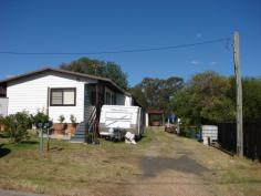 52 Mount Street, Aberdeen NSW 2336 This Residence or suite of units offers the bonus of a living in premises and a rented Two (2x) Bedroom flat. The property could serve and investor as two Flats ( 1 x 3 B/r plus 1 x 2 B/r) or someone could owner occupy the front 3 Bedroom home and collect rent on the Two Bedroom at the rear. The current owner does just that ! It comprises 1/52 Mount Street as a three bedroom home with Lounge room (Split Air), Tidy bathroom, Kitchen, (all electric) Meals dining area, sun deck porch and a great big 7 mtr double garage workshop plus twin carports. It's a mammoth shed and there's plenty of access. The back suite has Two Bedroom with a generous day room, Kitchen, Tiled bathroom and laundry. The gross rent potential for these flats would be around $20,000 plus per year. The entire property on a 1011 sqm lot all one Torrens title deed. Excellent investment or look after your retirement Sell at $280,000. more details visit www.ehpfirst.com.au