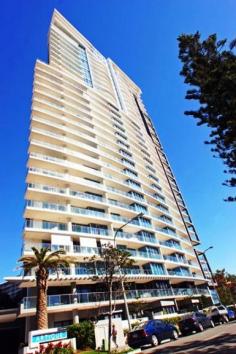 Surfers Paradise, QLD 4217 Ocean & Broadbeach Views Here is an opportunity to own a prestigious 2 bedroom (1+1) apartment in a stunning 30 level Raptis high-rise. Each apartment has ducted personal control air-conditioning, spacious open plan living areas and generous balconies. The kitchens are fully equipped with quality European appliances. You will notice the high standard of finishes and inclusions throughout as well as acoustic treatments which exceeds Australian standards. Facilities - Lifestyle and Recreation: - Private theatre room for resident use - Heated indoor merging outdoor swimming pool - Spa - Sauna - Steam room - Fully equipped gymnasium - Virtual Golf simulation games room - Poolside barbeque and entertainment area Location: - Located beachside in Surfers Paradise, 150 metres from the beach - Contemporary design - Ageless quality - Sculptural form - Lush tranquil landscaped gardens synonymous with Raptis developments - Elegant entry with exclusive facilities to complete a quality lifestyle - An easy stroll to Surfers Paradise shopping precinct and night life - Minutes to Casino, Pacific Fair and the new Gold Coast Convention Centre.