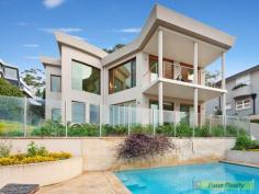 Kangaroo Point NSW 2224 Classy Tranquil Living An
astounding near new home enviably located on one of the best streets of
the blue ribbon location of Kangaroo Point/Sylvania. This charming
north facing home boasts of a unique design that exudes luxury, class
and sophistication within a peaceful and serene environment. Overlooking
the lovely tranquil waters of Georges River towards Bald Face Point,
this deep water front property has direct water access. This beautiful
spacious 1000m2 (approx)home not only provides for comfortable spacious
living but also generous space for any occasion. This property
features: 5 bedrooms 3 baths Marble spa Designer kitchen Home office Ducted air-conditioning In ground salt water pool 3 garages Security View Sold Properties for this Location View Auction Results