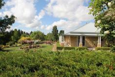 454 Rouse Street Tenterfield NSW PERFECTION - Peaceful Tree Change.
$499,000.00
Close to the famous Tenterfield Golf Club, this exquisite quality
built sandstone block home is set on 2.2 glorious acres surrounded by a
beautiful and secret garden on the edge of town. This masterpiece has 87
square metres of verandah wrapped around the home taking full advantage
of the elevated position with terrific views. The tastefully
designed home features 4 spacious bedrooms with built ins; main with
ensuite, a country style New Guinea Rosewood kitchen, dining and lounge
room with central wood heating, plush bathrooms and large laundry. This
classy home possesses a contemporary design with a flare of elegance
featuring quality finishes including decorative plaster cornices,
colonial architraves and windows, dado rails and solid brass hardware
throughout. The well thought out garden features a beautiful fishpond
with waterfall, bearing fruit trees, 120 roses and a huge variety of
cool climate trees and shrubs. To help with the maintenance in the
garden there is a licensed bore with electric submersible pump with an
extensive drip irrigation system to the whole block. Double garage
with remote door and internal access, and a large colorbond shed with
power, phone, toilet facilities and ample workshop space. This property has plenty of room to conduct a home business.