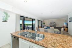 One of only a couple of
beachfront reserve apartment options available in Caves Beach, this
property distinguishes itself from the others in a big way. Offering
features far superior to its neighbours, in terms of bigger apartment
size, bigger garaging options and genuine ocean views with direct beach
access not available in the bigger apartment options set back from the
beach. Set in a more intimate group of only 5 apartments, this
property boasts the only internally accessed 2 car remote entry garage.
The current owners have their boat, car and plenty of shelving and
stored items comfortably arranged inside. The apartment itself
features generous, softly down-lit open plan living that flows off the
entry and out to an extremely large, covered outdoor living area. The
minute you walk inside you are taken aback by the unexpected
spaciousness of the living and also the delightful outlook to beachfront
shrubbery and ocean views. Spot the whales or count the ships and enjoy spectacular sunrises and amazing Nor Easterly breezes all summer long. The
living flows off the top end, quality, 2 pack and granite designer
kitchen, which is complete with not only an outlook to the living areas,
both inside and out but also the ocean view. The internal living
offers large dining and large lounge options with 2 sets of big stacker
doors connecting the living to the oversized, outdoor living and the
ocean view. A genuine, separate laundry also opens out to the deck and is complete with a very handy second toilet. The
deck boasts room for both outdoor lounge and dining options with a tap,
power and lighting all provided for extended easy all seasons
indoor/outdoor living. Back inside discover 2 king size bedrooms
both complete with generous built in wardrobes and easy access to the
oversized bathroom with a feature large heat pump spa and separate
shower.