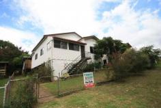 Tyalgum NSW, 2484 Located centrally to the village of Tyalgum, this comfortable residence is waiting for a new family to call her home. Comprising; * Three spacious bedrooms, plus one sleep out * Large eat-in kitchen with marble bench tops and breakfast bar * Renovated bathroom with terazzo flooring with separate shower room and toilet * Polished timber floor boards through out with wood fire stove in lounge room * Low maintenance vinyl cladding on the exterior with brand new corrugated iron room * Single lock-up garage along with additional storage under the dwelling Within walking distance to nearby school and shops, with the added bonus of rear land access, this great family home under $300,000 is well worth an inspection!!