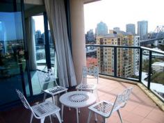 Goodwin St Kangaroo Point QLD 4169 You will have a hard time finding a property with a more impressive
outlook than this one. The views from the 14 th level span approximately
270 degrees and can be best appreciated from any one of the apartments
four balconies. The fully air-conditioned interior comprises three
bedrooms, the main bedroom's marble encased ensuite provides twin vanity
basins and full size bath. The kitchen's granite bench tops and quality
European appliances are everything you might expect. The expansive
living and dining areas are light, open and invite the outdoor vistas
inside.
Quality buildings offer top quality amenities and this dockside tower is
no exception. A foyer sure to impress all your visitors, sensational
indoor lap pool, gymnasium, spa, sauna and beautifully manicured gardens
that lead down to the riverside boardwalk, ferry terminal, shops,
cafes, etc etc.
If a relaxing lifestyle is as important as easy access to the CBD then
this property should hit the spot with the most discerning sector of the
property market.
Call us today on (07) 3249 6868 to arrange your inspection.