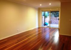 AUSTINMER NSW 2515 Oversized Townhouse tucked away for privacy yet minutes to famous Austinmer Beach, cafes, schools and station enjoy the spacious feel of a home with convenience of no maintenance. Tuck the surfboard under your arm and take an easy stroll to the beach or visit nearby cafes and boutiques in Moore Street, the choice is yours! Generous sized living/dining area with polished timber flooring and looking onto lush gardens and opening onto private sunny courtyard, ideal entertaining or just relaxing. Adjoining modern kitchen and separate downstairs WC, make it easy for summer living/entertaining.