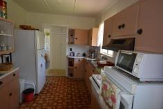 144 Talbot St Berserker QLD 4701 $299,000 This one owner highset cabinboard home is in a handy Northside location close to schools, major shopping centres & transport. The home has 3 bedrooms (main with A/C), A/C open plan lounge/dining, original kitchen & bathroom. Covered front patio with views of the Berserker Mountains to sit & enjoy a cool summer drink or a cup of tea all year round. The home is enclosed & fully lockable under with 2 car accommodation. The level allotment is fully landscaped & fenced. Be quick this is sure to sell! - See more at: http://www.professionalsrockhampton.com.au/real-estate/property/755895/for-sale/house/qld/berserker-4701/144-talbot-street/#sthash.jrnGNUTG.dpuf