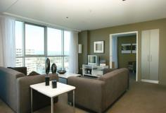 Surfers Paradise, QLD 4217 Ocean & Broadbeach Views Here is an opportunity to own a prestigious 2 bedroom (1+1) apartment in a stunning 30 level Raptis high-rise. Each apartment has ducted personal control air-conditioning, spacious open plan living areas and generous balconies. The kitchens are fully equipped with quality European appliances. You will notice the high standard of finishes and inclusions throughout as well as acoustic treatments which exceeds Australian standards. Facilities - Lifestyle and Recreation: - Private theatre room for resident use - Heated indoor merging outdoor swimming pool - Spa - Sauna - Steam room - Fully equipped gymnasium - Virtual Golf simulation games room - Poolside barbeque and entertainment area Location: - Located beachside in Surfers Paradise, 150 metres from the beach - Contemporary design - Ageless quality - Sculptural form - Lush tranquil landscaped gardens synonymous with Raptis developments - Elegant entry with exclusive facilities to complete a quality lifestyle - An easy stroll to Surfers Paradise shopping precinct and night life - Minutes to Casino, Pacific Fair and the new Gold Coast Convention Centre.