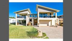 103 School of Arts Road Redland Bay QLD 4165 WATCH THE SUNRISE OVER MORETON BAY It SIMPLY doesn't get much better than this STUNNING BAYSIDE BEAUTY presented to you in pristine condition... Masterfully built and architecturally designed to achieve the maximum views and bay breezes from almost every vantage point. You will be' blown away' with the sheer QUALITY and the myriad of inclusions....9' ceilings, gleaming Southern SPOTTED GUM floors, STONE Bench tops, Butler's Pantry, quality lighting and window treatments throughout, vacuumaid, security system, the list is lengthy, it's one great surprise after another. The master bedroom has a luxury ensuite bathroom with spa bath, a massive walk in robe, and it's own personal balcony to kick back and enjoy a glorious sunrise. Downstairs comprises of 2 bedrooms, deluxe bathroom, wet bar, Billiard room and lounge/media room, and would easily adapt to a DUAL LIVING SITUATION if required. Vehicle accommodation consists of a large double garage with Seamless flooring, and a huge Boat/Caravan Port, with access to rear of property. Neatly terraced and manicured gardens make weekend maintenance a breeze. Situated in the Orchard Beach waterfront estate surrounded by Upmarket homes, General Features Property Type: House Bedrooms: 5 Bathrooms: 3 Land Size: 801 m² (approx) Indoor Features Toilets: 3 Alarm System Built-in Wardrobes Outdoor Features Remote Garage Secure Parking Garage Spaces: 3 Balcony Outdoor Entertaining Area Fully Fenced Other Features Built-In Wardrobes,Close to Schools,Close to Shops,Close to Transport,Garden