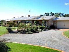 9 Cameron Court Clifton Springs VIC 3222 LARGE QUALITY HOME ON APP. 1 ACRE, WELL DESIGNED WITH STYLE AND FLAIR Architect designed large family home with freestanding 1 bedroom unit. Formal lounge and dining, second informal open plan area includes kitchen, informal meals and living, third room for theatre or rumpus. Extra large main bedroom more like a retreat with bathroom and huge WIR, remaining 2 bedrooms have BIR's and study or 4th bedroom. Central bathroom, laundry, separate toilet and powder room. No. 9 has loads of style, light and space and exudes warmth througout..... impressive! Features; ducted heating, gas log fire, loads of storage, quality fittings, fireplace, split system, duc.vac. sprinkler system and so much more. Outside entertaining area overlooks lush gardens, double garage completes this gracious home in this exclusive position. General Features Property Type: Lifestyle Bedrooms: 4 Bathrooms: 2 Land Size: 3800 m² (approx) Indoor Features Ensuite: 1 Outdoor Features Garage Spaces: 2