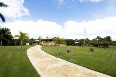 9 Curlew Crescent Cooroy QLD 4563 ENJOY THE SERENITY! Rolling lawns, neat gardens enhance this lovely traditional family home. This very large quality brick home only 10yrs old, is located very close to Cooroy town centre and sits on a fantastic 3399sqm easily maintained parcel of land. • Quiet street location, can walk to Cooroy • Nothing to do, extremely well maintained brick home • Large generously proportioned rooms • Very large master bedroom suite with WIR & open style en- suite • Beautiful north facing front verandah with open outlook • Glorious kitchen with large island bench and granite tops • Undercover parking to the side plus huge garage shed at the rear • Tools, equipment and ride on mower offered with the sale of home • Terrific family home on large accessible and usable parcel of land • Real value for money and only 15min drive to Noosa & attractions WON’T LAST LONG, DO NOT DELAY YOUR INSPECTION Watch our video for more photos and call Loretta Lehmann today.