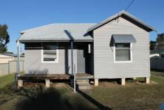 55 Wollombi Road Cessnock NSW 2325 This weatherboard & iron home would make an ideal first home or investment property. It would even suit someone down sizing but yet not ready to go into a unit. Features include 3 double bedrooms main with air conditioning, updated kitchen & bathroom, spacious living area, internal laundry with 2nd W.C, single carport & all located on an 809sqm block. Centrally located and only minutes to Cessnock's main CBD.
