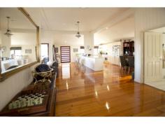 4/30 Taunton Street Annerley Qld 4103 Renovated Dual Living Queenslander Style Home SALE ON THE DAY – DISREGARD ALL PREVIOUS PRICING – ILLNESS FORCES ACTION NOW. From this elevated position you can enjoy sunsets and city views on your front verandah. Move straight in and enjoy the elegance and space of the fully renovated 2 level home. In the style of front and side open verandahs with feature timber entry this home will impress at first glance. The character of the era in the french doors and the timber work on the verandah are stunning. The rooms are light-filled and larger than life.. High ceilings give a further feeling of space. The fully equipped kitchen has top of the range appliances and stone bench-tops ample cupboard storage. The main bedroom upstairs is double sized with an office, large en-suite with spa bath and elegant sun-room of its own, in the style of a parents retreat. The 2nd bedroom is also upstairs and serviced by the main bathroom. Formal living dining and open-plan kitchen bring warmth and continuity to the upstairs. Downstairs is tiled throughout and with 3 large bedrooms, main with en-suite, built-ins, main bathroom and kitchenette. The 2 car remote control garage enters the downstairs living area. Conveniently situated 5 klms from Brisbane CBD, a short walk to Fairfield train station and Annerley Shopping Centre. You will not be disappointed in the quality and size of this home. Call now for an inspection.