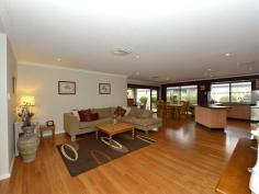 16 Strathalbyn Loop Carramar WA 6031 BURKE'S BACKYARD MEETS MASTERCHEF! Immaculately presented 4 bedroom 2 bathroom home with incredible chef's kitchen and impeccable manicured gardens. Warmth and ambience abound as you enter this home with blackbutt wood flooring and down lighting throughout. Absolutely huge bedrooms with large walk in robes (except bed 2 has BIR) and ducted air conditioning. This home is every Stepford Wife's dream with gorgeous kitchen featuring glass splash backs, large wide drawers, overhead cabinets, 900mm stainless gas cook top, stainless steel oven and dishwasher with an over sized bench top for easy entertaining. Stunning family and meals area overlooks the gorgeous outdoor area. Double width sliding doors featuring timber blinds open out to stunning alfresco with timber decking and Designer wind down Blind. Enjoy endless summer days and balmy nights sipping wine on the timber decked pool surrounded by lush Hibiscus and fragrant Roses. The well manicured garden features additional grassed area, shed and a fabulous fruiting olive tree. Domestic bliss with masses of storage and laundry fitted with storage cabinets, built in trough and walk in linen closet. Overview of features: General Features Property Type: House Bedrooms: 4 Bathrooms: 2 Indoor Features Toilets: 2 Air Conditioning Outdoor Features Garage Spaces: 2 Open Car Spaces: 4 Other Features Built-In Wardrobes,Close to Schools,Close to Shops,Close to Transport,Garden,Alfresco, gas point